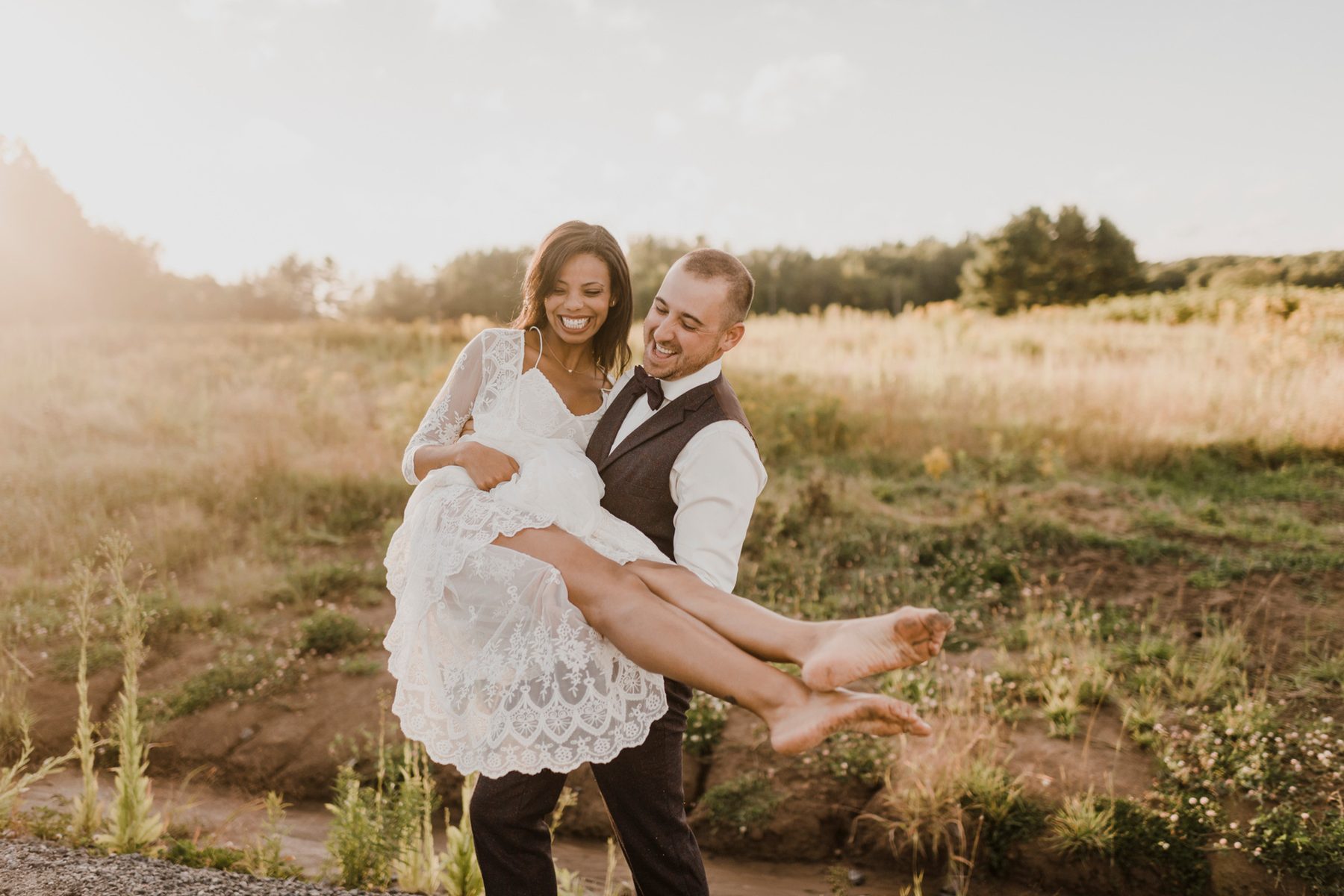 A couple embracing in a quiet open field
