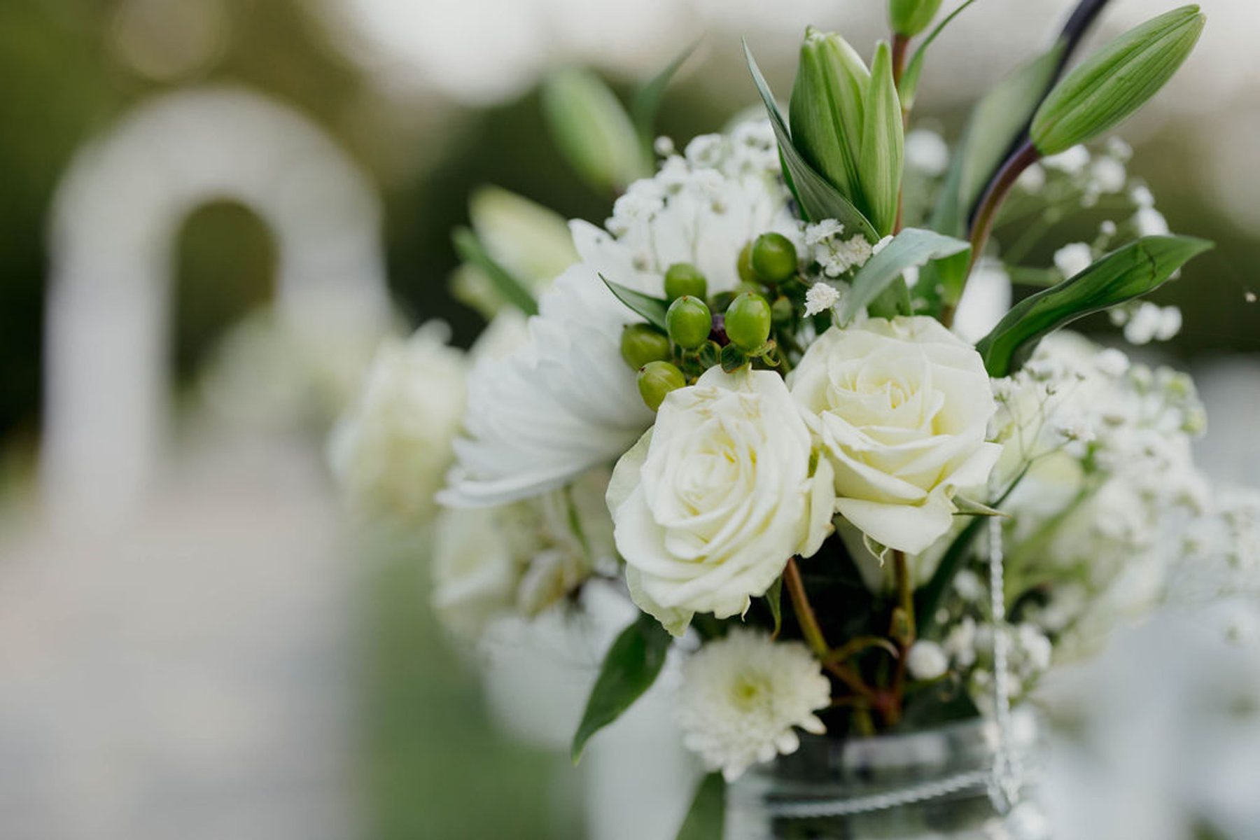 A white floral arrangement in soft daylight