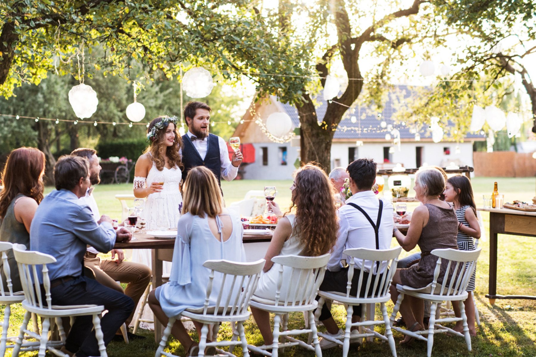 Outdoor reception tables set beneath open sky
