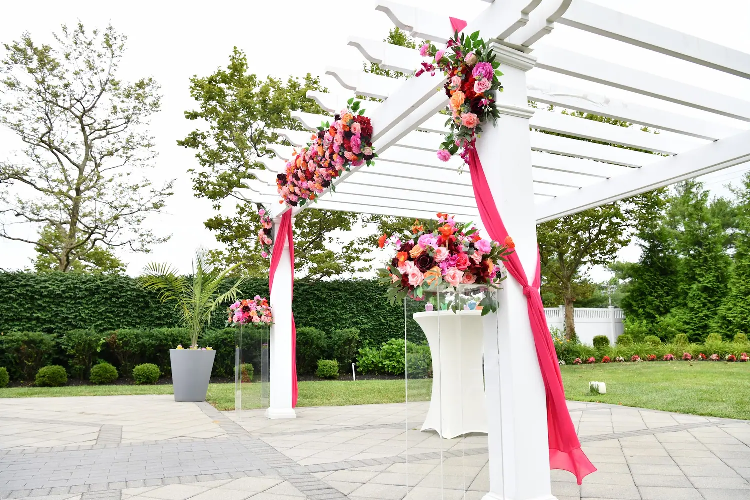 The floral ceremony arch with ribbon detail