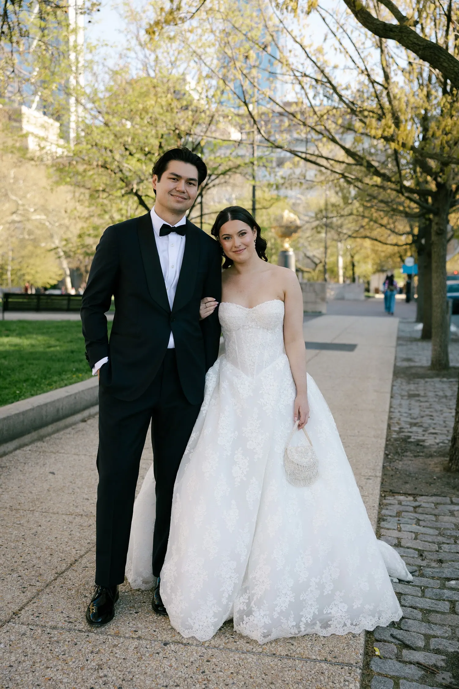 The couple photographed on a tree-lined city street