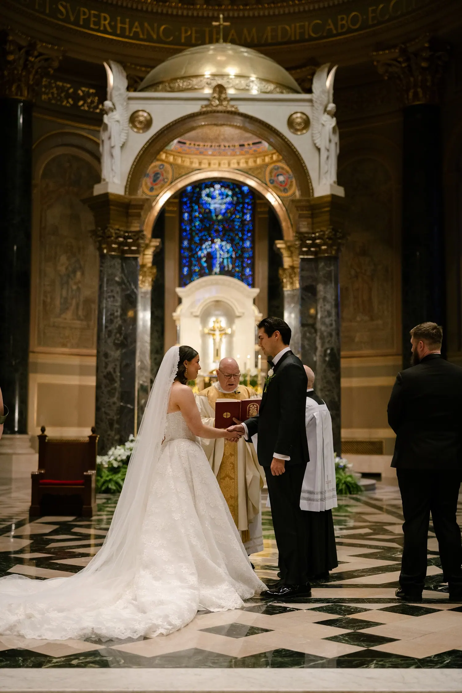Ceremony at the altar under the stained glass